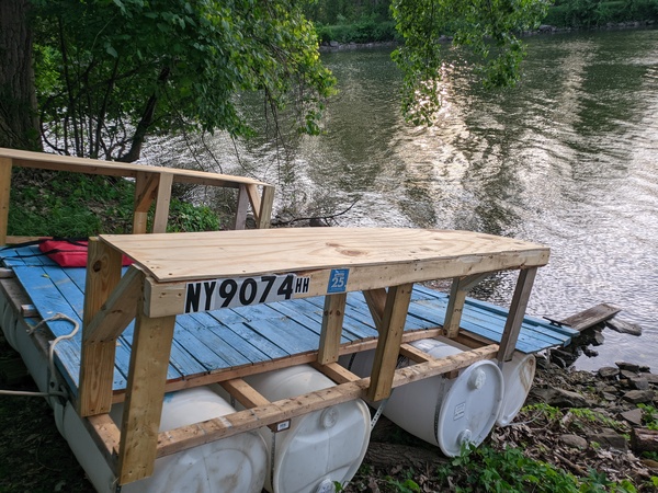 The boat being relaunched after adding benches to it. It is proudly displaying its hull number
