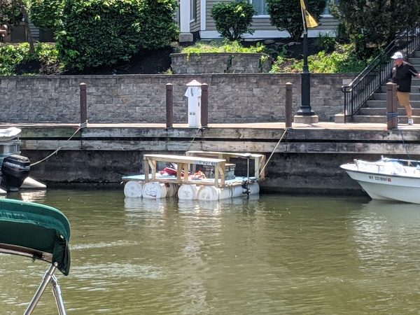 A picture from afar showing the boat tied up at a dock