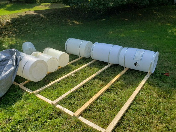 The boat being constructed. There is a wooden frame with a few barrels attached