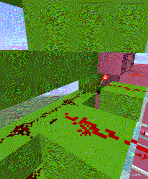 A picture of a redstone torch nestled in between the output of the green circuit and input to the pink