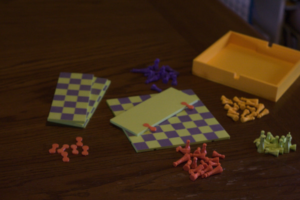 A picture of the parts of a four player chess board, all laid out